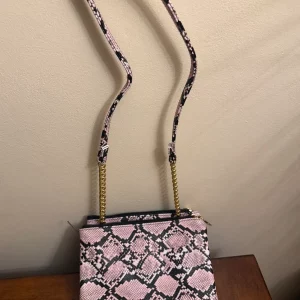 Pink and black shoulder bag