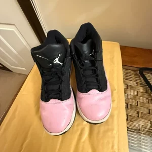 Pink and black air Jordan trainers