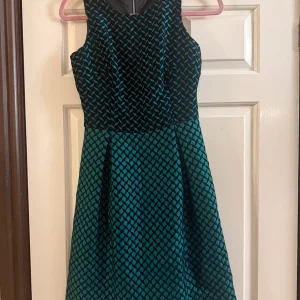 Green and black coast dress